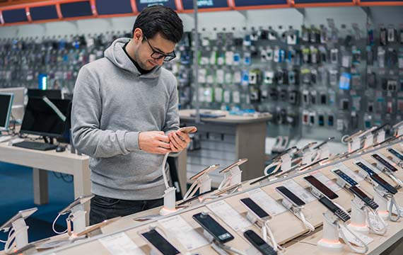 A man choosing a cell phone