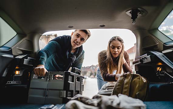 interior perspective of students unloading from the hatchback of a car