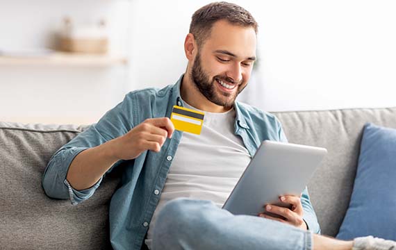 Man with credit cards buying online
