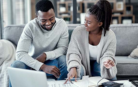 Couple planning adn  laughing