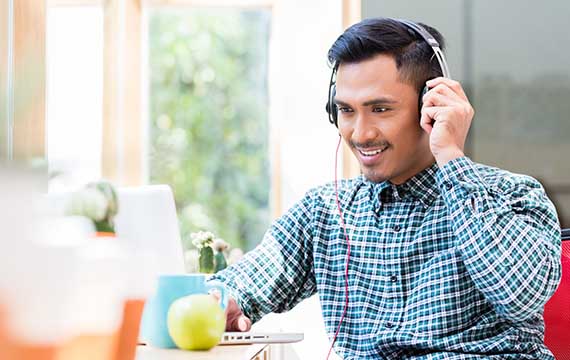 A man smiling with hearphones