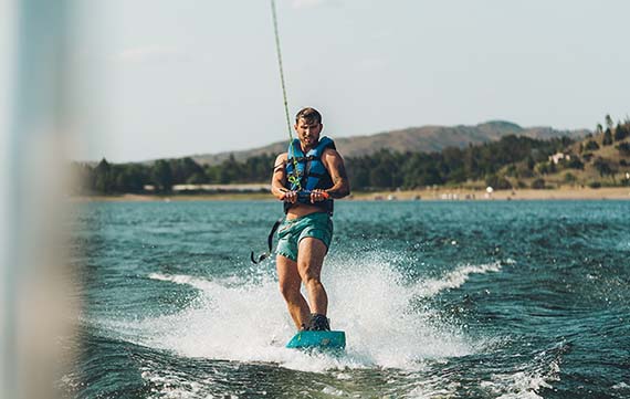 young man wakeboarding
