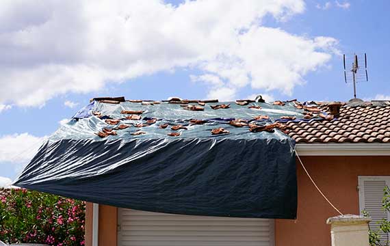 tarp over roof protects against further damage